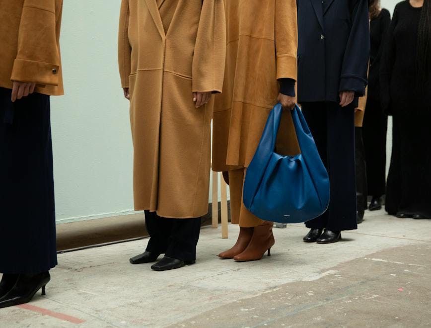 coat bag handbag adult female person woman overcoat high heel purse