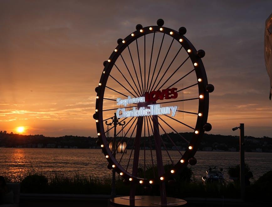 outdoors sky person amusement park ferris wheel fun animal bird boat vehicle