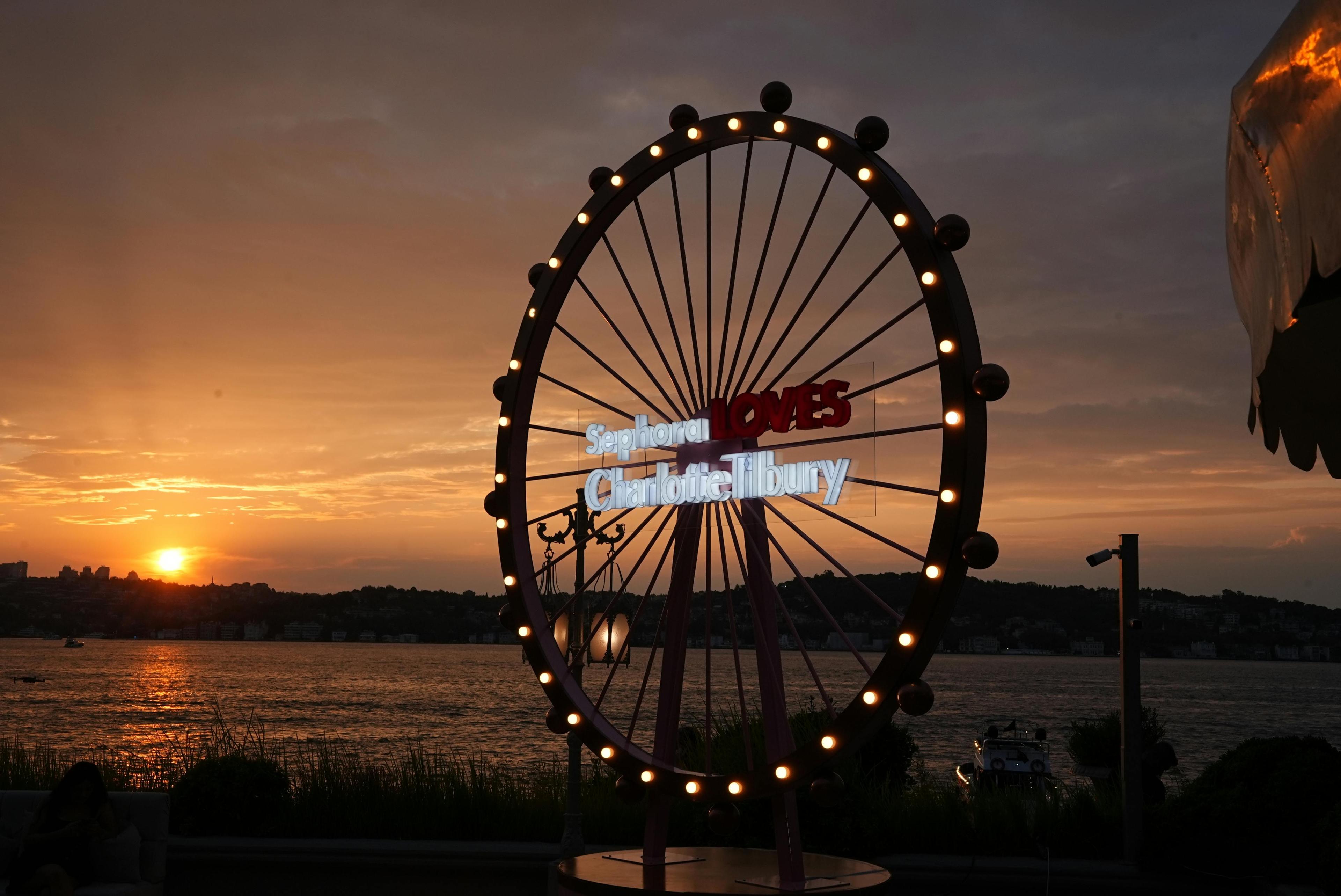 outdoors sky person amusement park ferris wheel fun animal bird boat vehicle